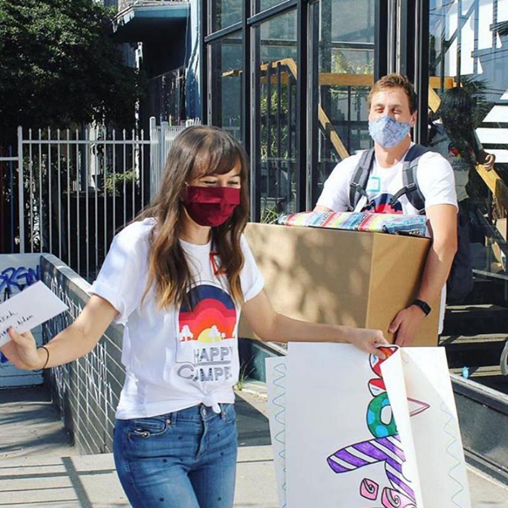 a cheerful man and woman performing volunteer activities